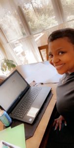 Virginia Byrd working from home on a laptop computer