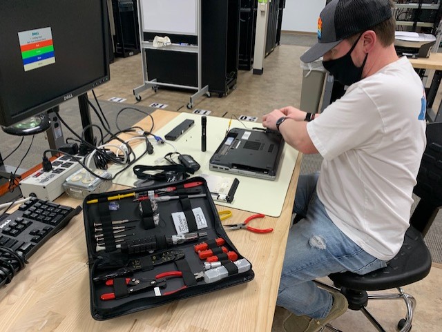ITA@SVHEC student Jonathan Tuck completes a hands-on lab using one of the 55-pc computer 
toolkits donated by Microsoft.