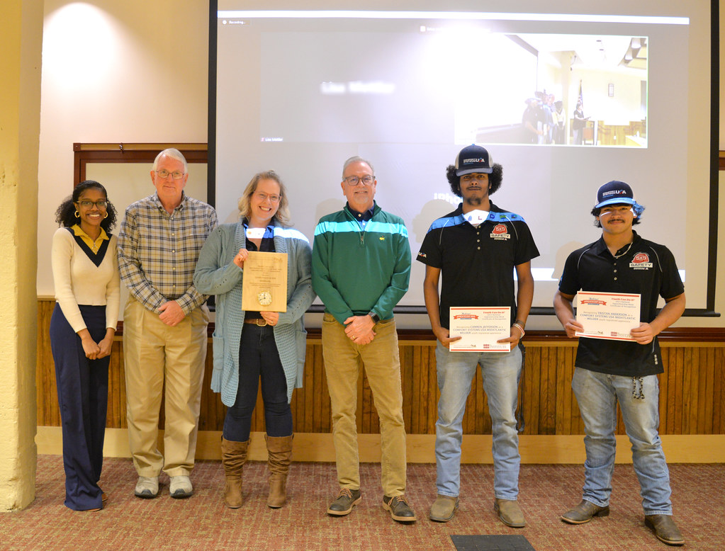 Apprenticeship Coordinator NaTori Neal with ComfortSystems leadership and their 2 apprentices.