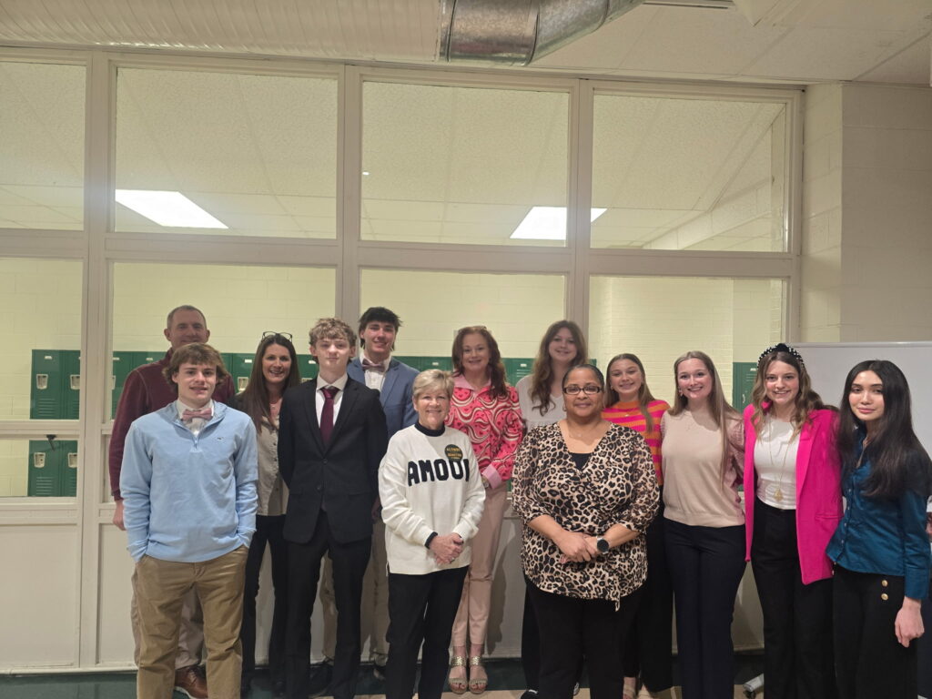 Entrepreneurship Education Coordinator Jocelyn Forest standing with the Kenston Forest School Capstone Class and adult volunteers.