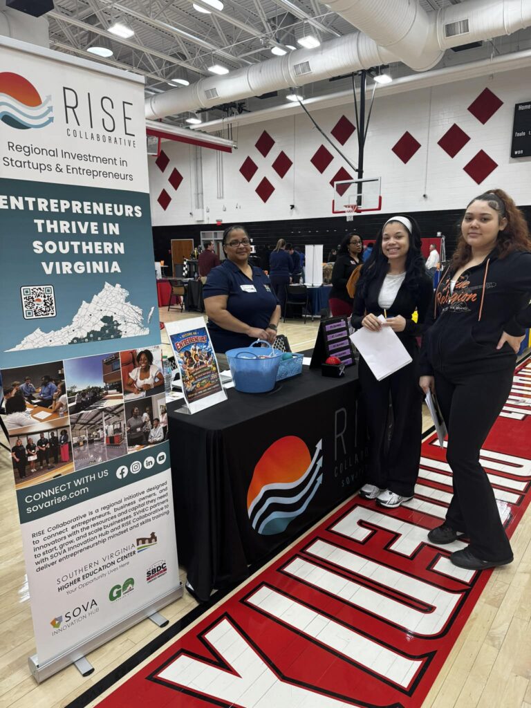 Entrepreneurship Education Coordinator Jocelyn Forest with students at the Mecklenburg County High School Career Fair.